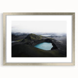 Framed wall art featuring a serene misty landscape design in soft gray and white tones, with a sleek silver frame and mat, perfect for modern decor.