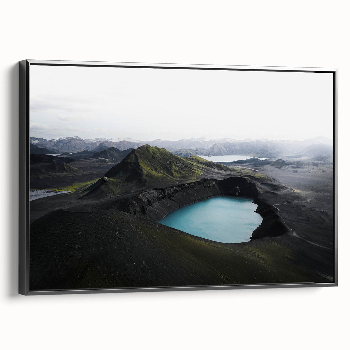 Framed canvas wall art featuring a misty landscape design in muted tones, showcasing a serene fog scene. The black frame adds a modern touch, ideal for enhancing home decor.