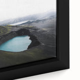 Close-up of a framed canvas showcasing a serene landscape with mist and fog, emphasizing soft hues of blue and gray, perfect for home decor or wall art collection.