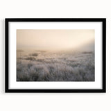 Framed landscape wall art featuring a serene misty forest scene, accented by a sleek black frame and mat, perfect for modern home decor.