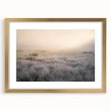Framed wall art featuring a serene landscape design with mist and fog, accented by a gold frame, perfect for adding elegance to any room decor.