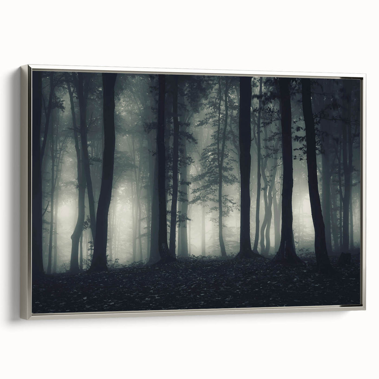 Framed canvas wall art showcasing a serene landscape design with mist and fog, accented with a silver frame, perfect for enhancing home decor.