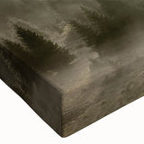 Close-up of a stretched canvas wall art piece depicting a serene misty landscape, featuring soft gray and blue tones, ideal for enhancing modern home decor.