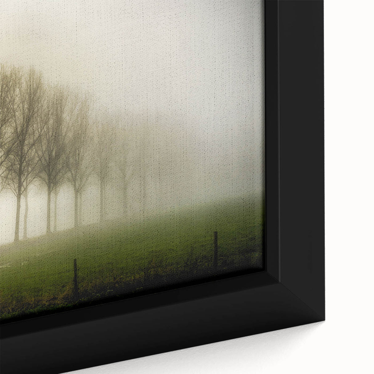 Close-up of a framed canvas wall art piece showcasing a serene landscape design with mist and fog, featuring soft gray and green hues that evoke tranquility. Perfect for home decor, this artwork adds a calming touch to any room.