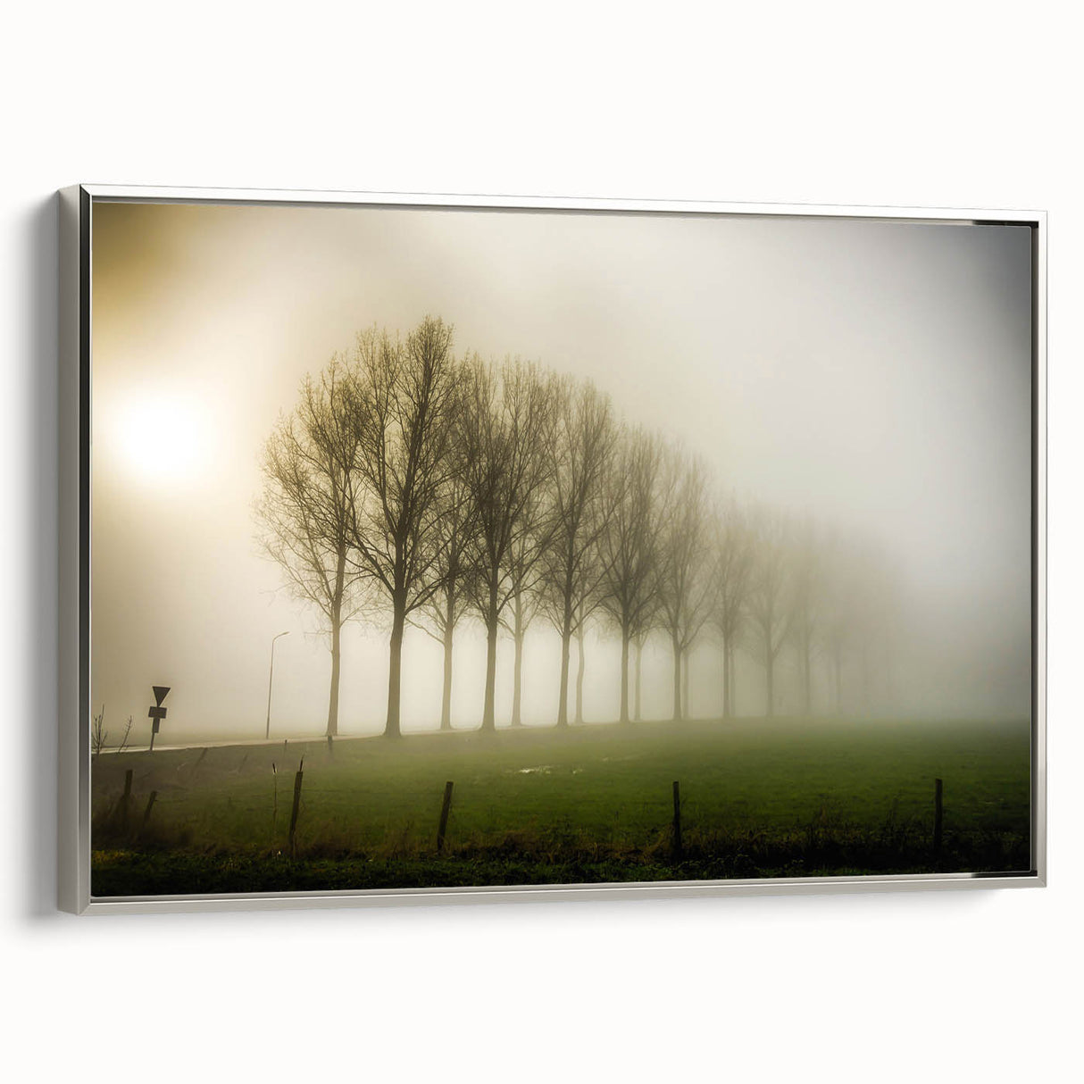 Framed canvas wall art featuring a serene landscape design with mist and fog, set in a silver frame, ideal for modern home decor and enhancing interior spaces.