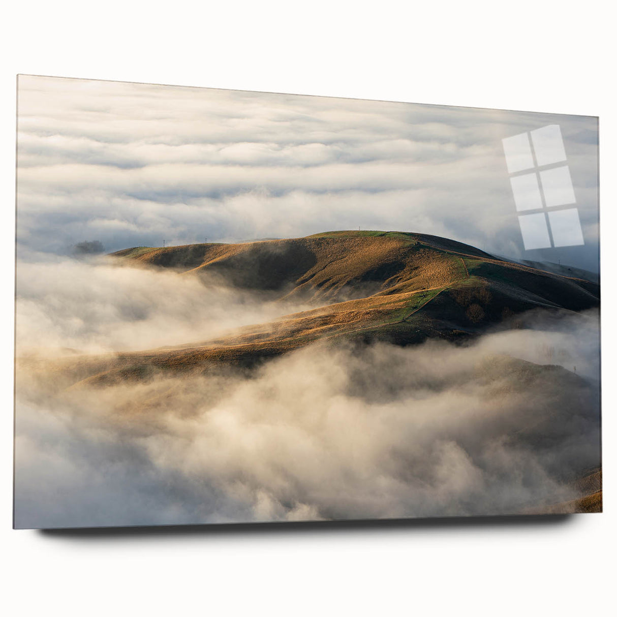 Acrylic glass wall art featuring a serene landscape with mist and fog, showcasing soft hues of gray and blue, ideal for modern home decor. The piece is designed elegantly without visible mounting pins, emphasizing its contemporary aesthetic.