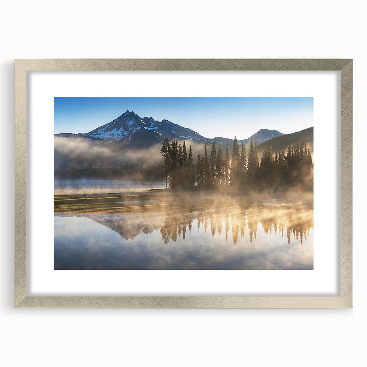 Framed silver wall art showcasing a serene misty landscape, perfect for home decor, with elegant matting enhancing the artwork's depth and beauty.