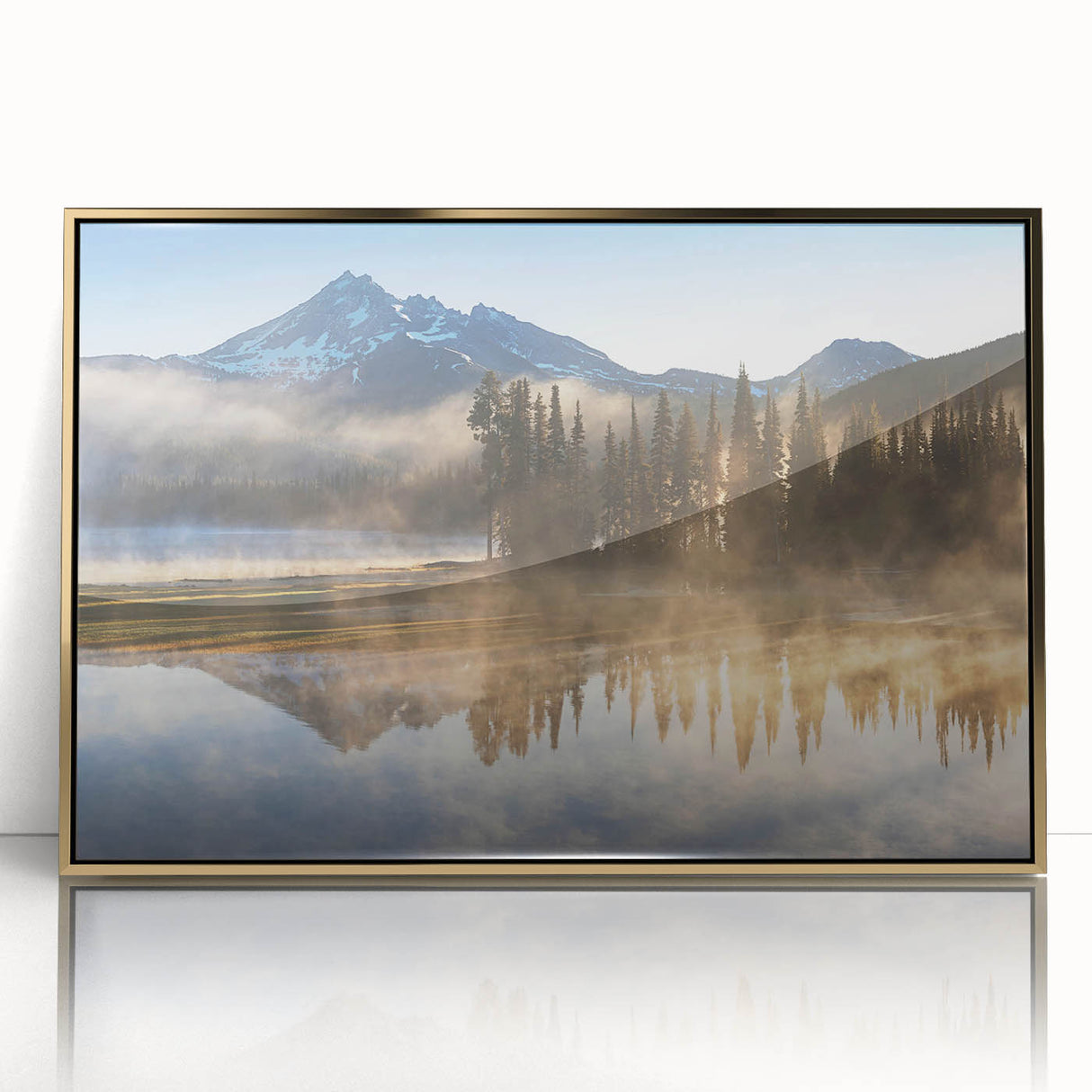 Framed acrylic wall art featuring a misty landscape design with soft fog and muted colors, elegantly displayed in a gold frame, ideal for home decor.
