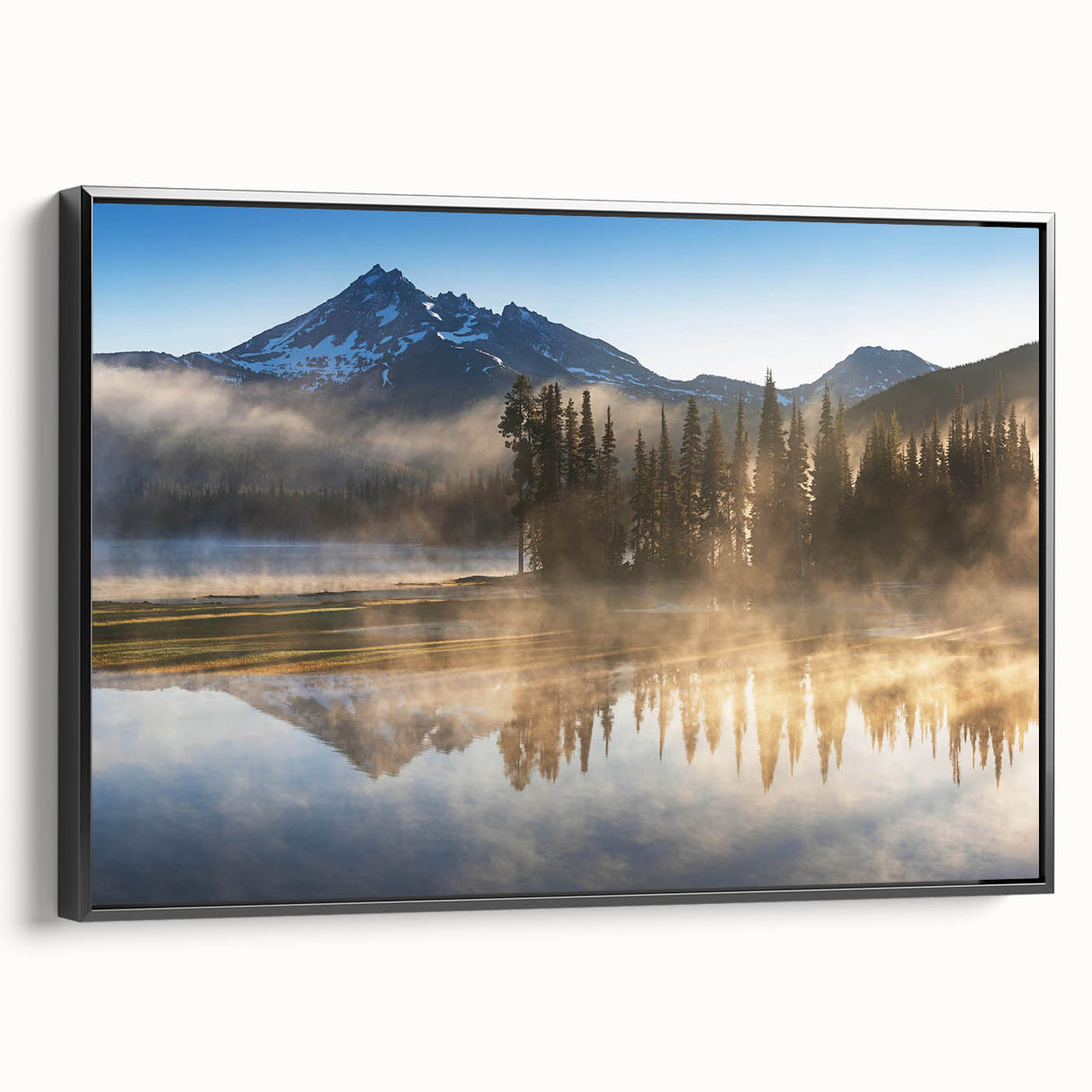 Framed canvas wall art showcasing a serene foggy landscape with muted colors and intricate details, viewed from the side to highlight its black frame.