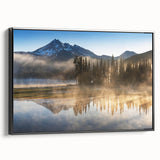 Framed canvas wall art showcasing a serene foggy landscape with muted colors and intricate details, viewed from the side to highlight its black frame.