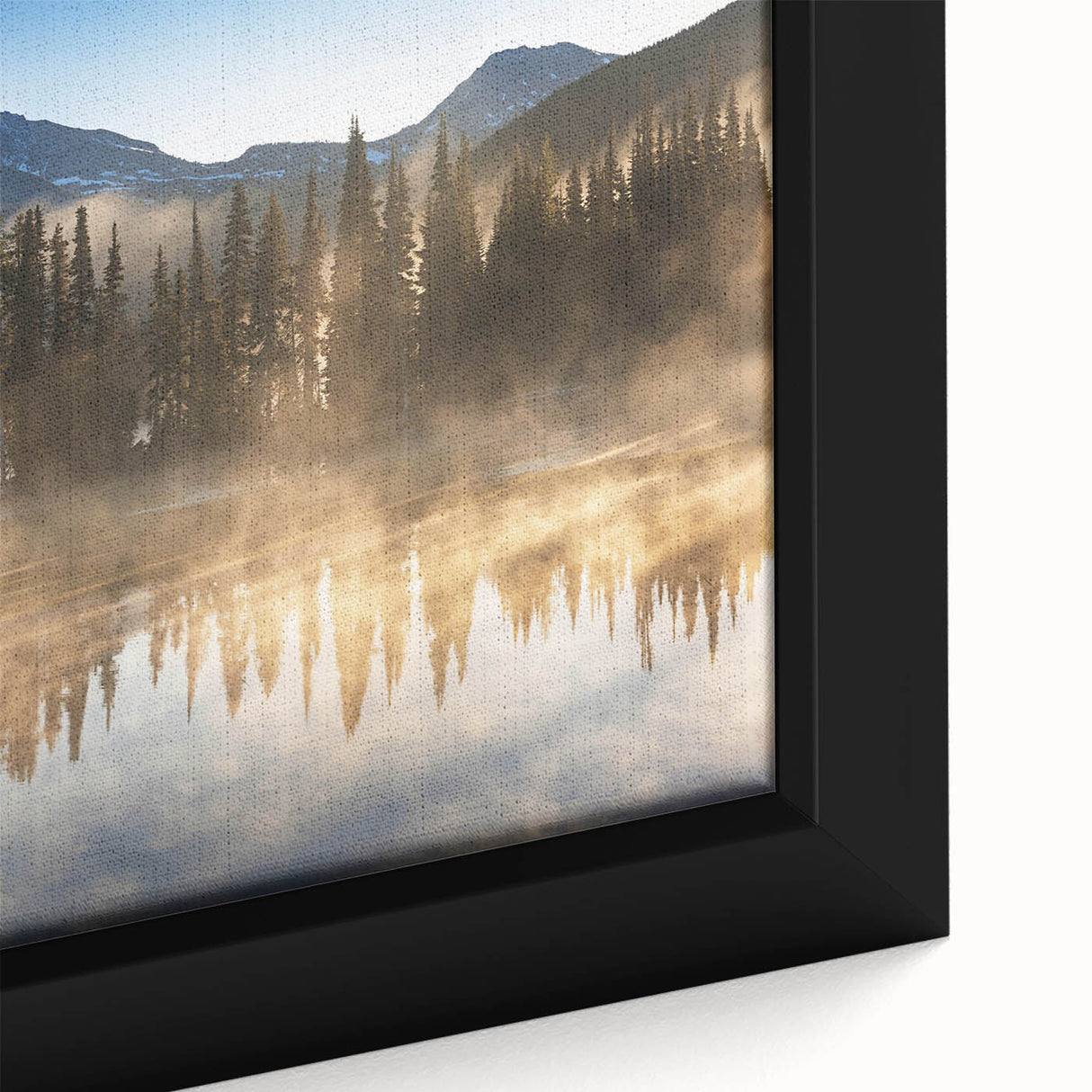 Close-up of a framed canvas art piece depicting a tranquil landscape shrouded in mist, featuring soft hues of blue and gray, perfect for enhancing home decor.
