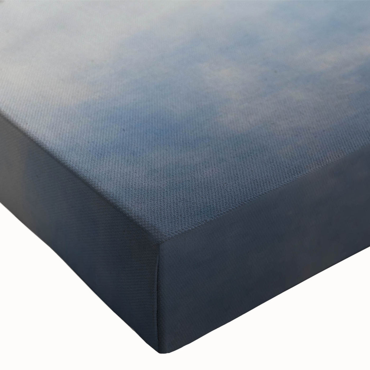Close-up of a stretched canvas wall art piece depicting a serene landscape enveloped in mist, showcasing soft hues of blue and gray, ideal for home decor.