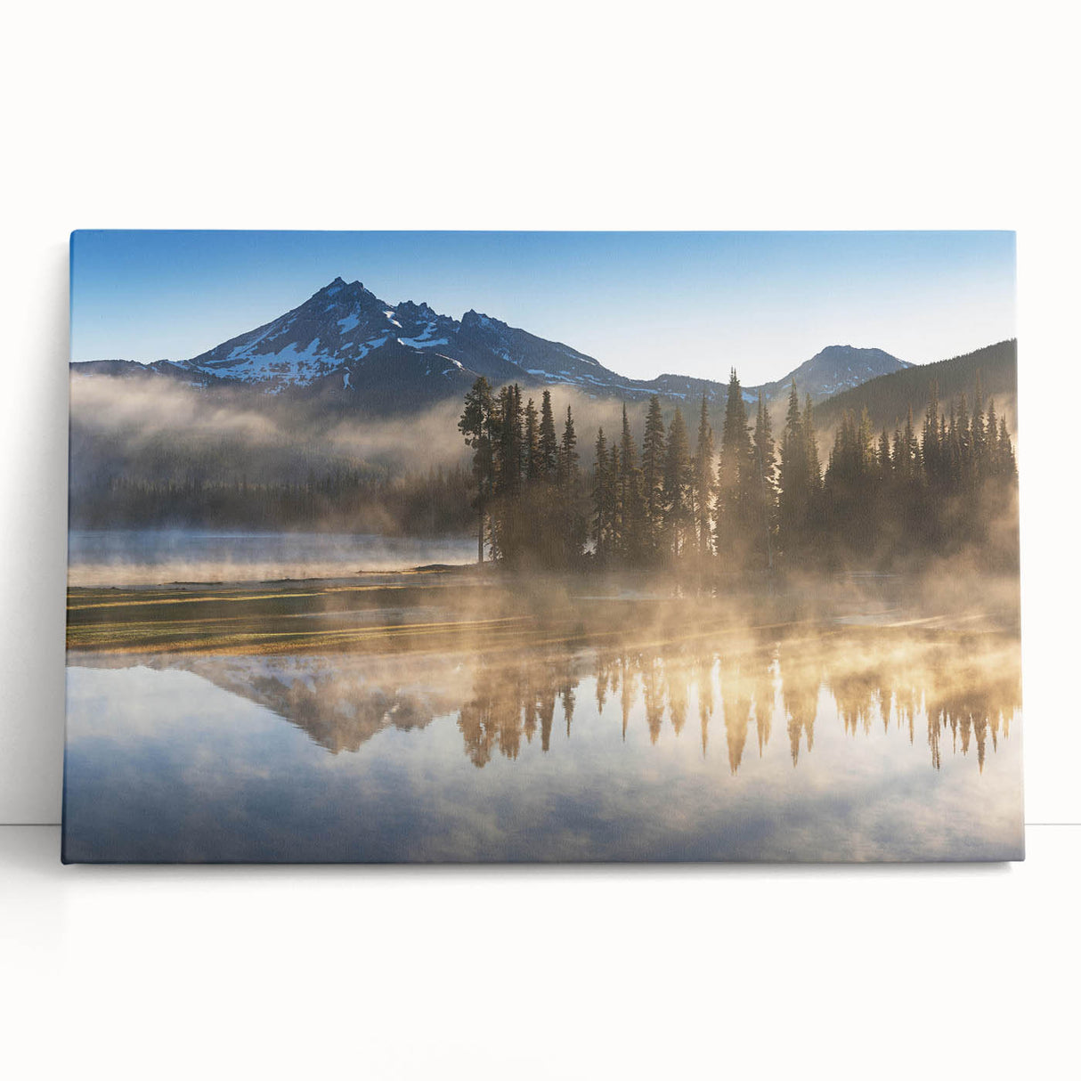 Stretched canvas wall art featuring a serene landscape with mist and fog, showcasing soft hues of blue and gray, perfect for enhancing home decor aesthetics.
