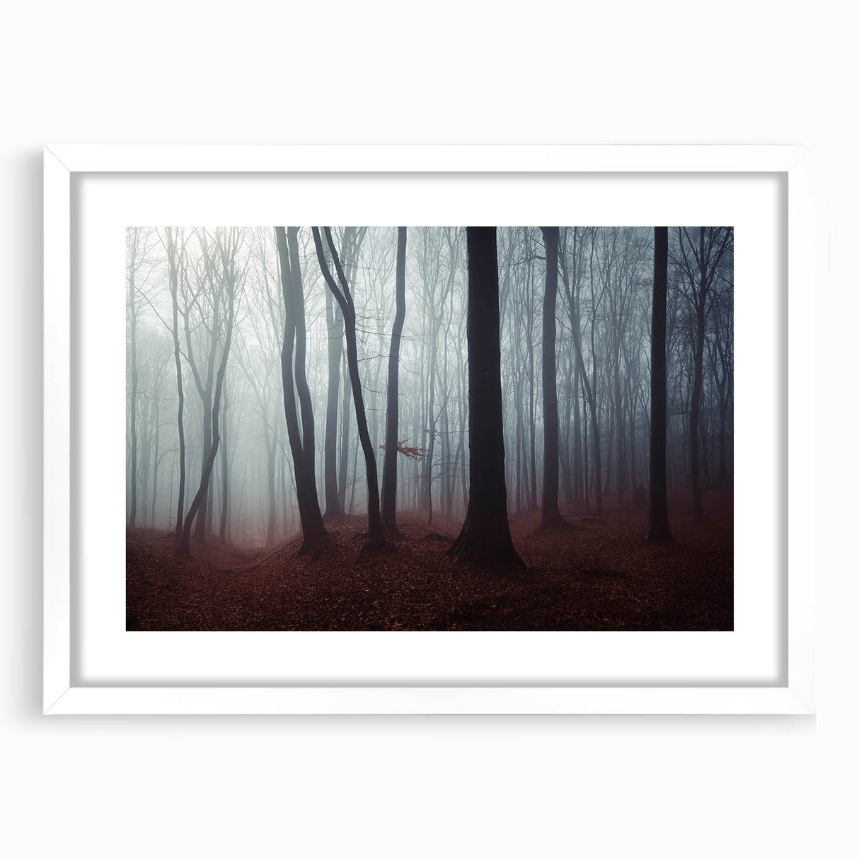 Framed wall art depicting a serene misty landscape with soft fog, featuring a white mat and frame, perfect for enhancing home decor with a calming atmosphere.