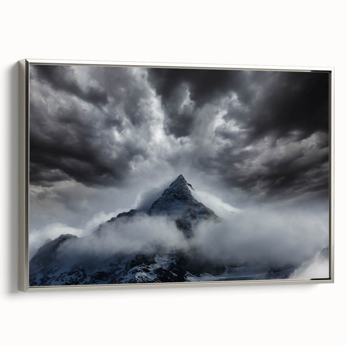 Framed wall art collection showcasing a serene landscape scene with mist and fog, set in a sleek silver frame, ideal for enhancing home decor.