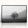 Framed acrylic wall art showcasing a serene misty landscape design with fog, featuring a sleek black frame, perfect for home decor aesthetics.