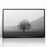 Framed acrylic wall art showcasing a serene misty landscape design with fog, featuring a sleek black frame, perfect for home decor aesthetics.