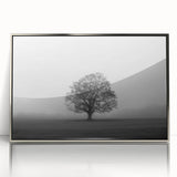 Framed acrylic wall art showcasing a serene landscape design with mist and fog, featuring soft gray and silver tones, perfect for enhancing modern decor.