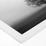 Serene rolled canvas artwork showcasing a misty landscape with soft fog enveloping lush green hills, perfect for adding a calming touch to any decor space.