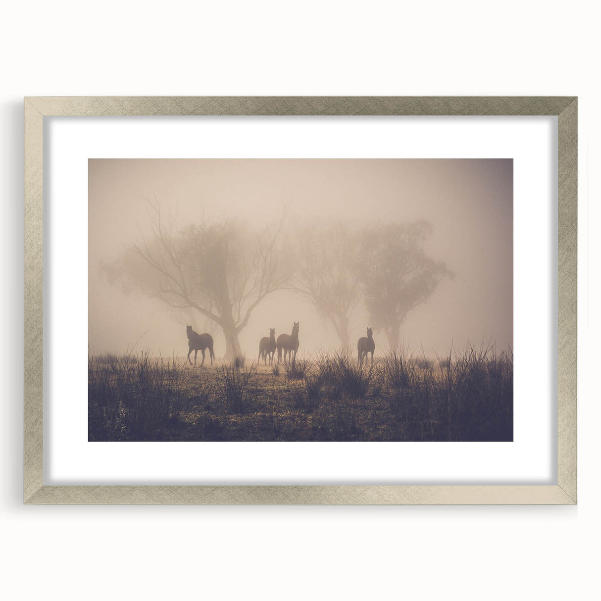 Framed wall art collection featuring a misty landscape design with a silver mat, showcasing serene hues of gray and blue. Perfect for modern home decor.