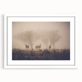Framed wall art featuring a serene landscape design of misty mountains and fog, set in a white mat and frame, ideal for enhancing modern decor.