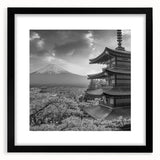 Framed landscape wall art featuring majestic mountains in shades of blue and gray, with a sleek black mat and frame, ideal for modern home decor.