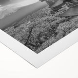 Stunning rolled canvas artwork depicting a serene mountain landscape at sunset, featuring vibrant hues of orange and purple, perfect for home decor.