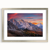 Framed wall art featuring a stunning mountain landscape design, showcasing vibrant colors and intricate details, set in a sleek silver frame with a mat. Perfect for enhancing home décor.