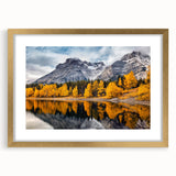 Framed wall art featuring a stunning mountain landscape design, with a gold mat and frame, ideal for home decor in a contemporary setting.