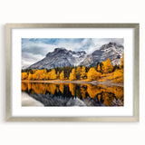 Framed wall art showcasing a serene mountain landscape design with a silver mat border, perfect for enhancing home decor and bringing a touch of nature indoors.