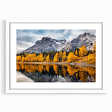 Framed wall art featuring a stunning mountain landscape design with vibrant colors, set in a sleek white frame with a mat, perfect for home decor.