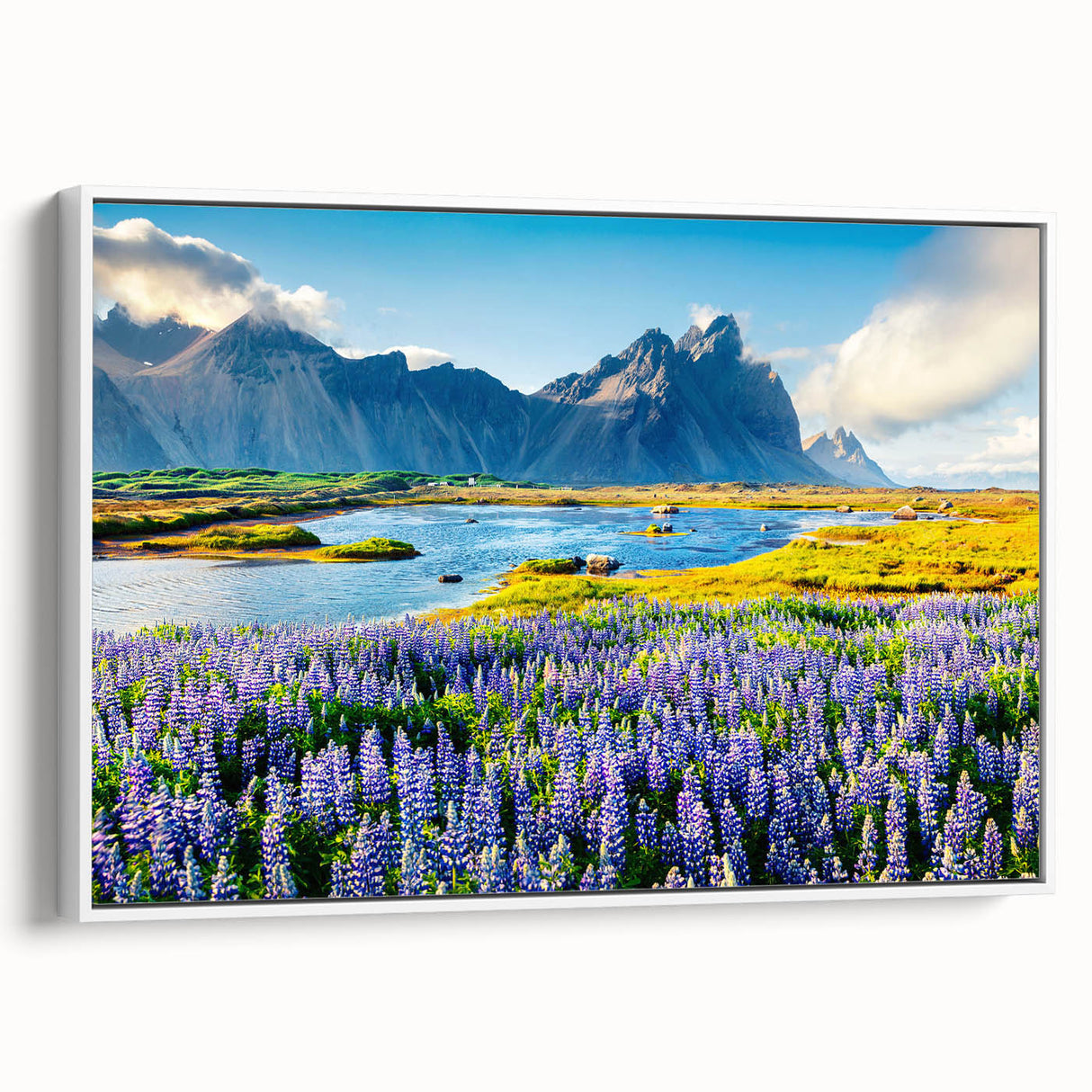 Framed canvas wall art showcasing a serene mountain landscape, featuring soft blue and green hues, perfect for adding a calming touch to home decor.