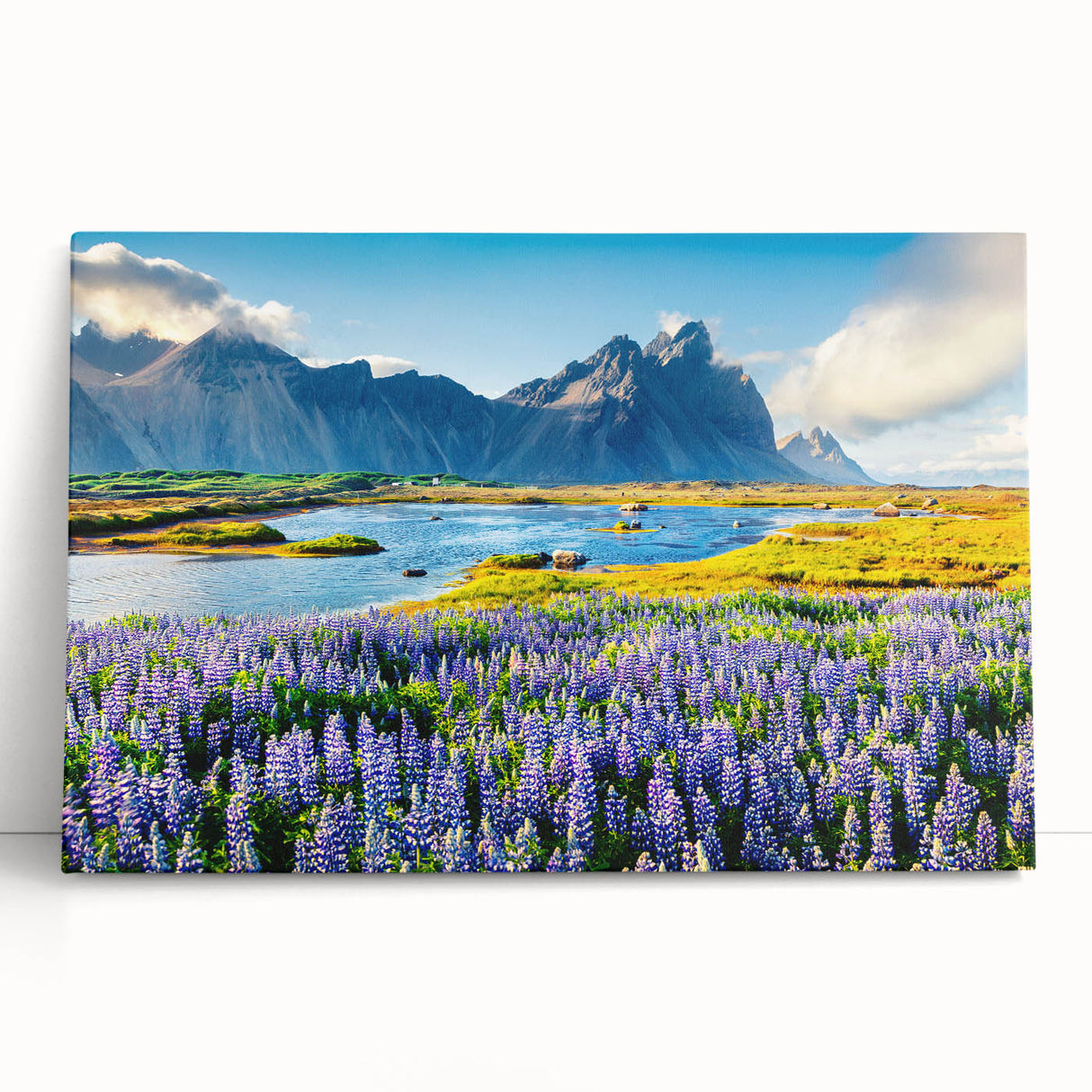 Colorful stretched canvas wall art featuring a scenic mountain landscape design, showcasing vibrant hues of blue and green, perfect for home decor accents.