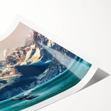 Vibrant landscape wall art print showcasing majestic mountains under a blue sky, rolled and ready for display, perfect for home or office decor.