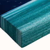 Close-up of a stretched canvas artwork showcasing a vibrant mountain landscape with rich colors and intricate details, perfect for home decor and nature lovers.