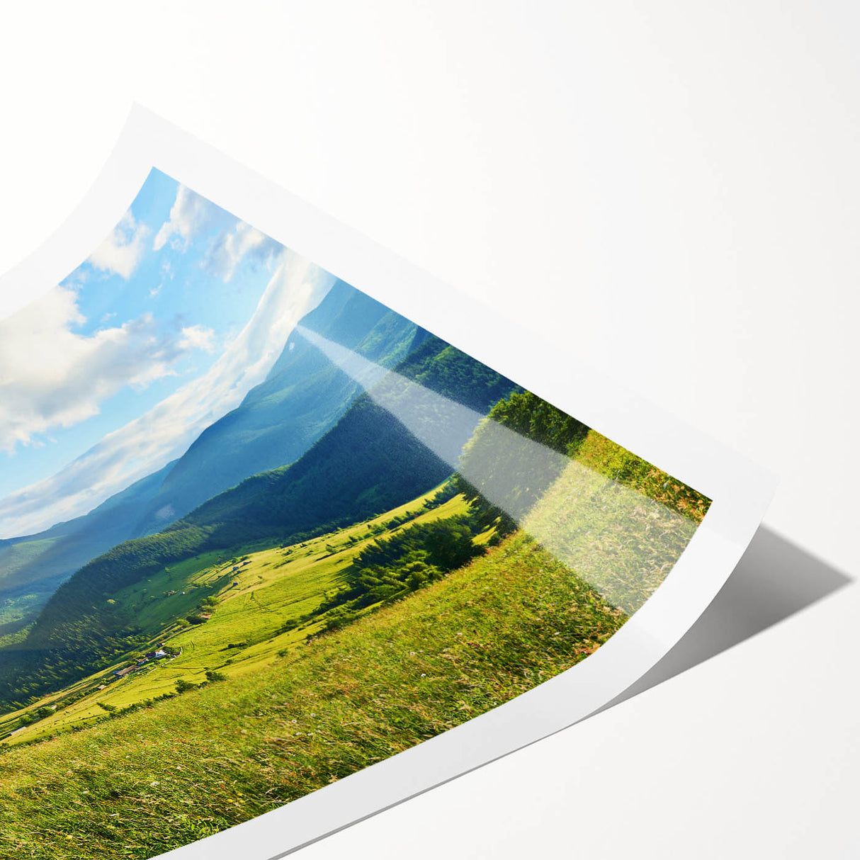 Mountain landscape wall art print showcasing vibrant green forests and majestic peaks under a clear blue sky, rolled and ready for framing, perfect for home decor.