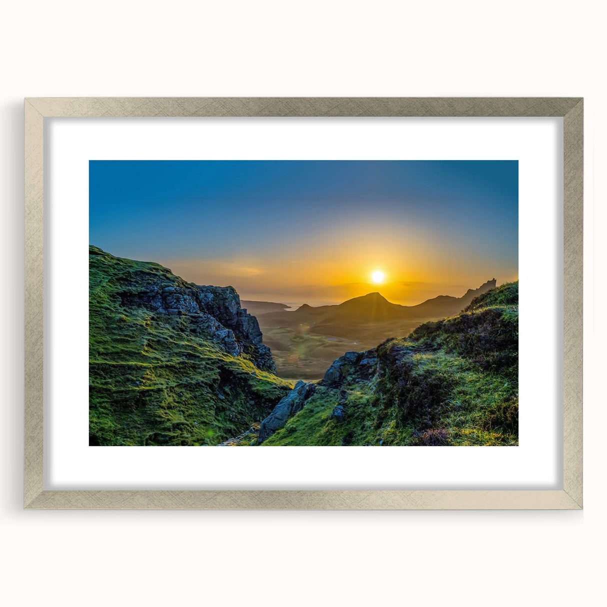 Framed wall art showcasing a stunning mountain landscape design with a silver mat and frame, perfect for enhancing modern home decor and interior aesthetics.