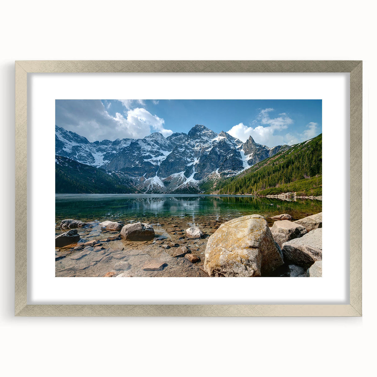 Framed landscape wall art featuring majestic mountains and serene skies, designed with a silver mat, perfect for enhancing home decor with nature-inspired elegance.