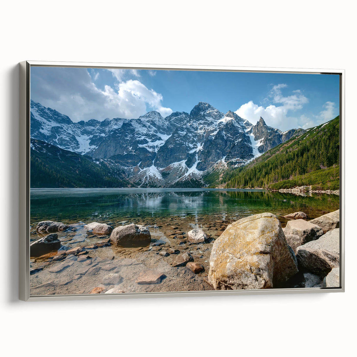 Framed canvas wall art showcasing a stunning mountain landscape in silver tones, designed to enhance modern decor with its elegant side view presentation.