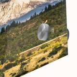 Close-up view of a vibrant acrylic wall art piece showcasing a mountain landscape design, featuring rich colors and intricate details, perfect for modern home decor.