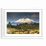 Framed wall art featuring a serene mountain landscape design with a white mat and sleek frame, perfect for enhancing home decor and creating a calming atmosphere.