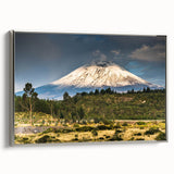 Framed canvas wall art featuring a stunning mountain landscape design, highlighting vibrant colors and intricate details, set against a sleek silver frame.