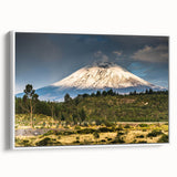 Framed canvas wall art showcasing a serene mountain landscape design with vibrant colors, displayed in a white frame, ideal for modern home decor.