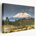Stretched canvas wall art depicting a serene mountain landscape with vibrant colors, perfect for adding a calming touch to home decor.