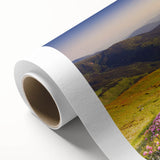 Stunning rolled canvas wall art depicting a serene mountain landscape with vibrant colors and intricate details, perfect for home decor or office aesthetics.