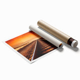 Vibrant rolled print of a scenic railroad landscape, showcasing lush greenery and a dramatic sky, perfect for enhancing home décor with nature-inspired art.