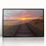 Framed acrylic wall art featuring a vibrant railroad landscape design, showcasing intricate details and bold colors, presented in a sleek black frame for stylish decor.