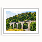 Framed wall art collection featuring a serene landscape with railroads, displayed in a stylish white frame, showcasing vibrant colors and intricate details for home decor.
