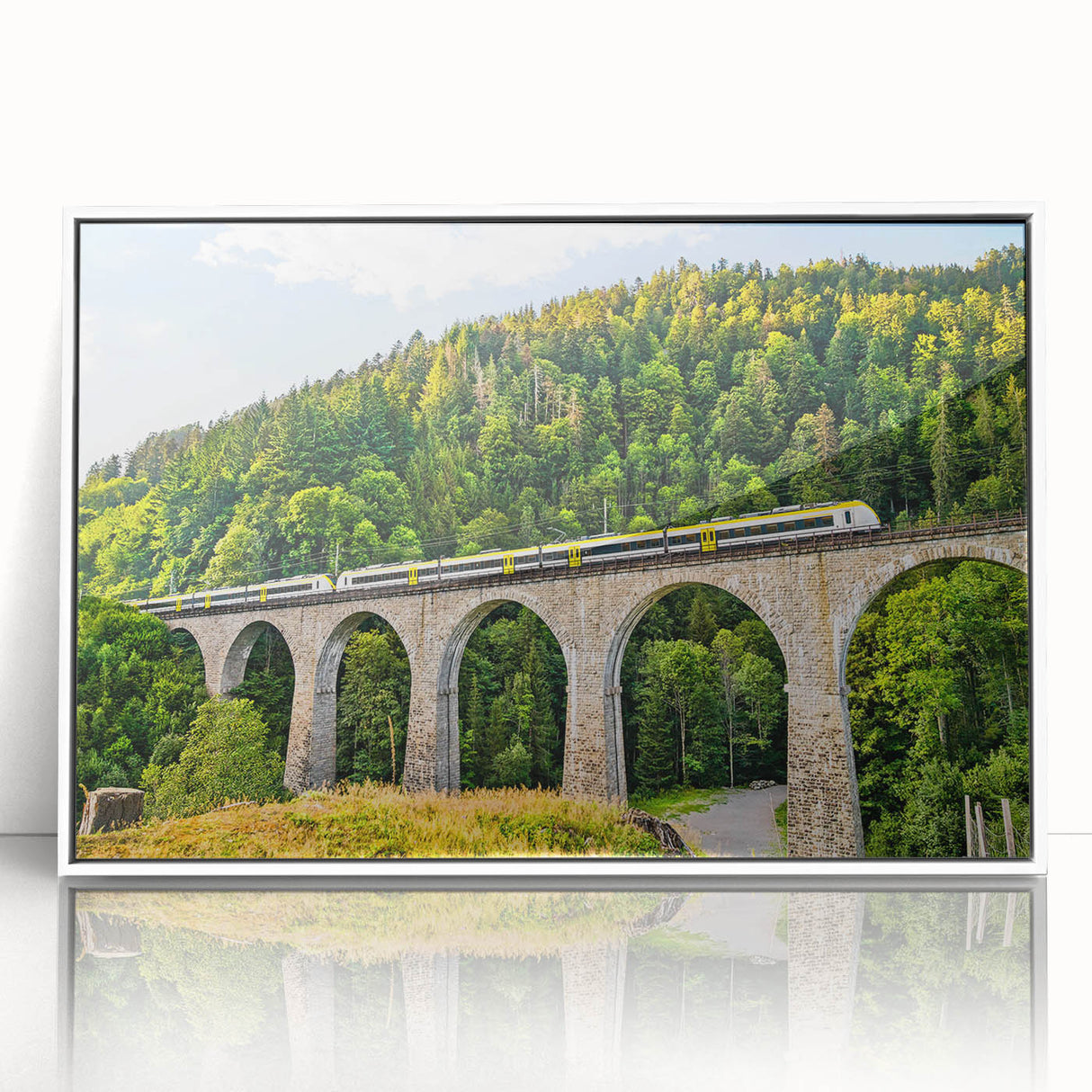 Framed wall art featuring a picturesque landscape with railroads, showcasing vibrant colors and intricate details, ideal for home or office decor.