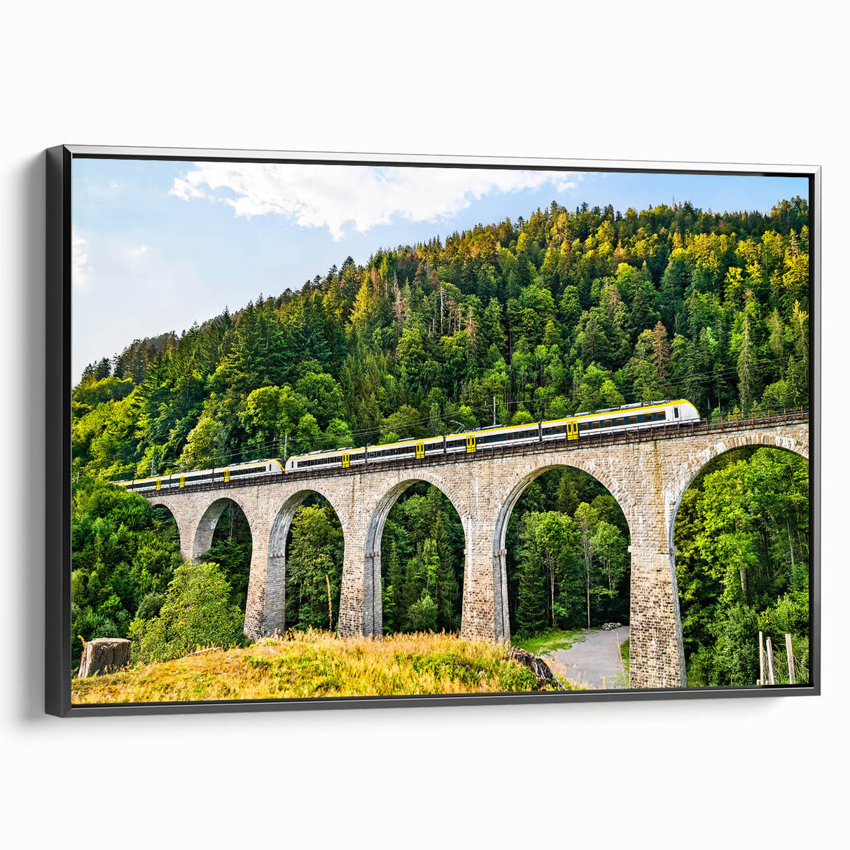 Framed canvas wall art collection showcasing a scenic landscape with railroads, presented in a sleek black frame, ideal for enhancing home decor.